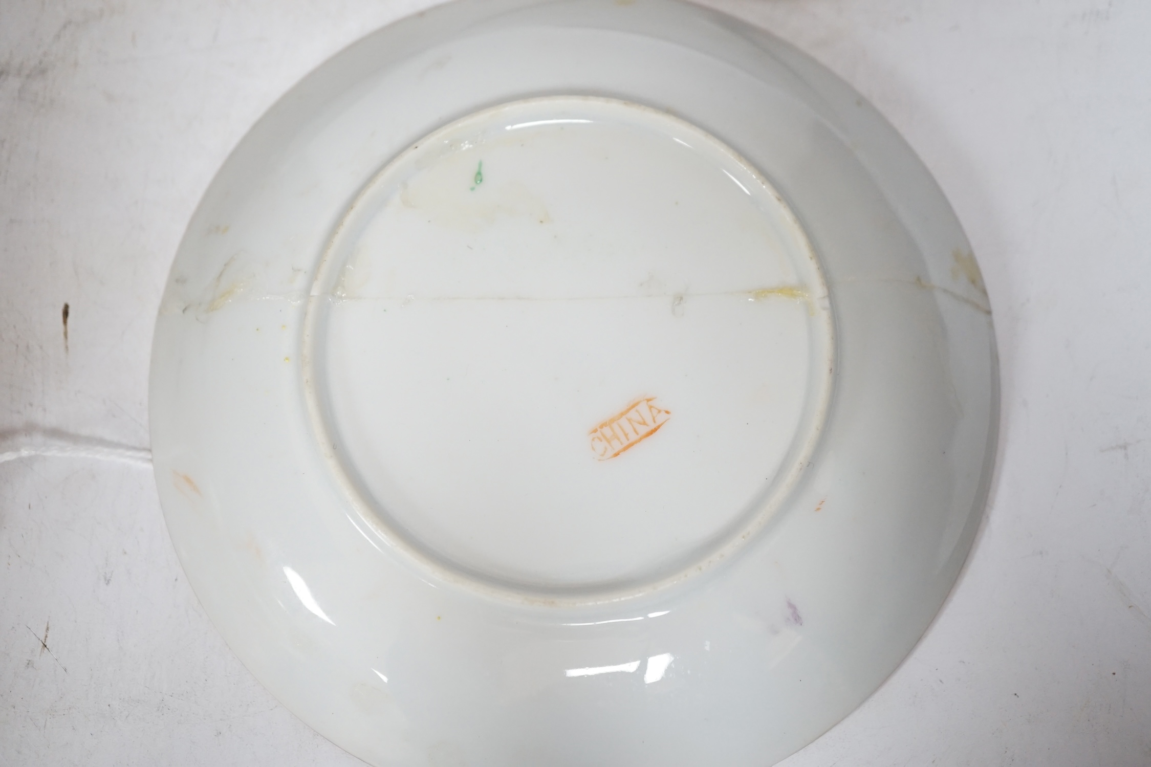 Four Chinese or Japanese porcelain saucers, largest 16.5 cm diameter